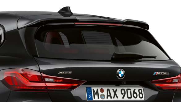 M rear spoiler. BMW M135i xDrive in Black Sapphire metallic, rear view with M rear spoiler.