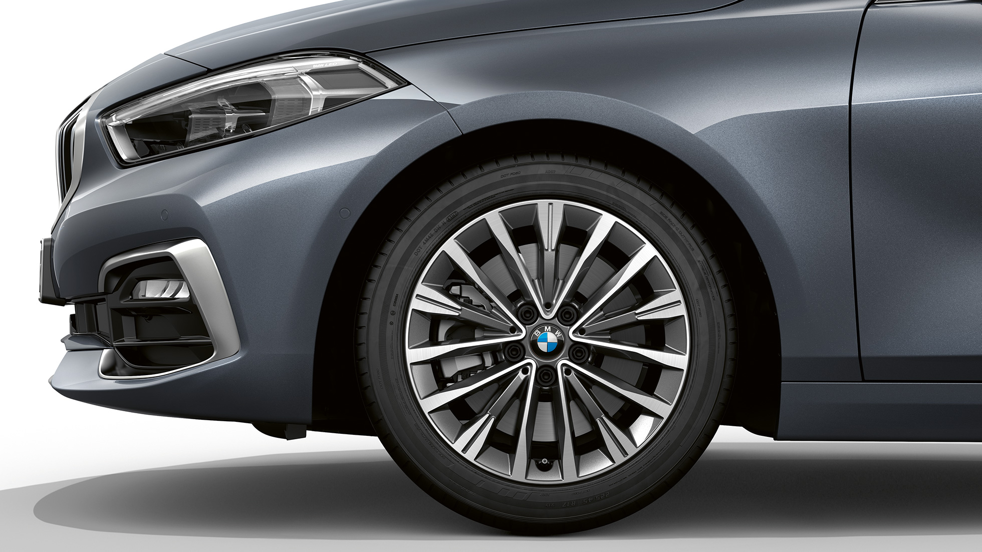 17" light-alloy wheel Multispoke 547 style. BMW 1 Series Model Luxury Line in Storm Bay metallic, side view of front with 17'' light-alloy wheel Multispoke 547 style.