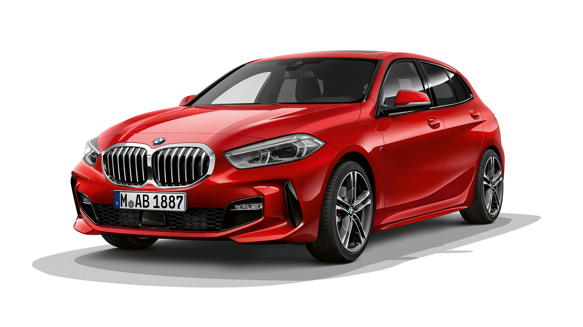BMW 1 Series Model M Sport, three-quarter front. BMW 1 Series Model M Sport in Melbourne Red metallic, studio shot three-quarter front.