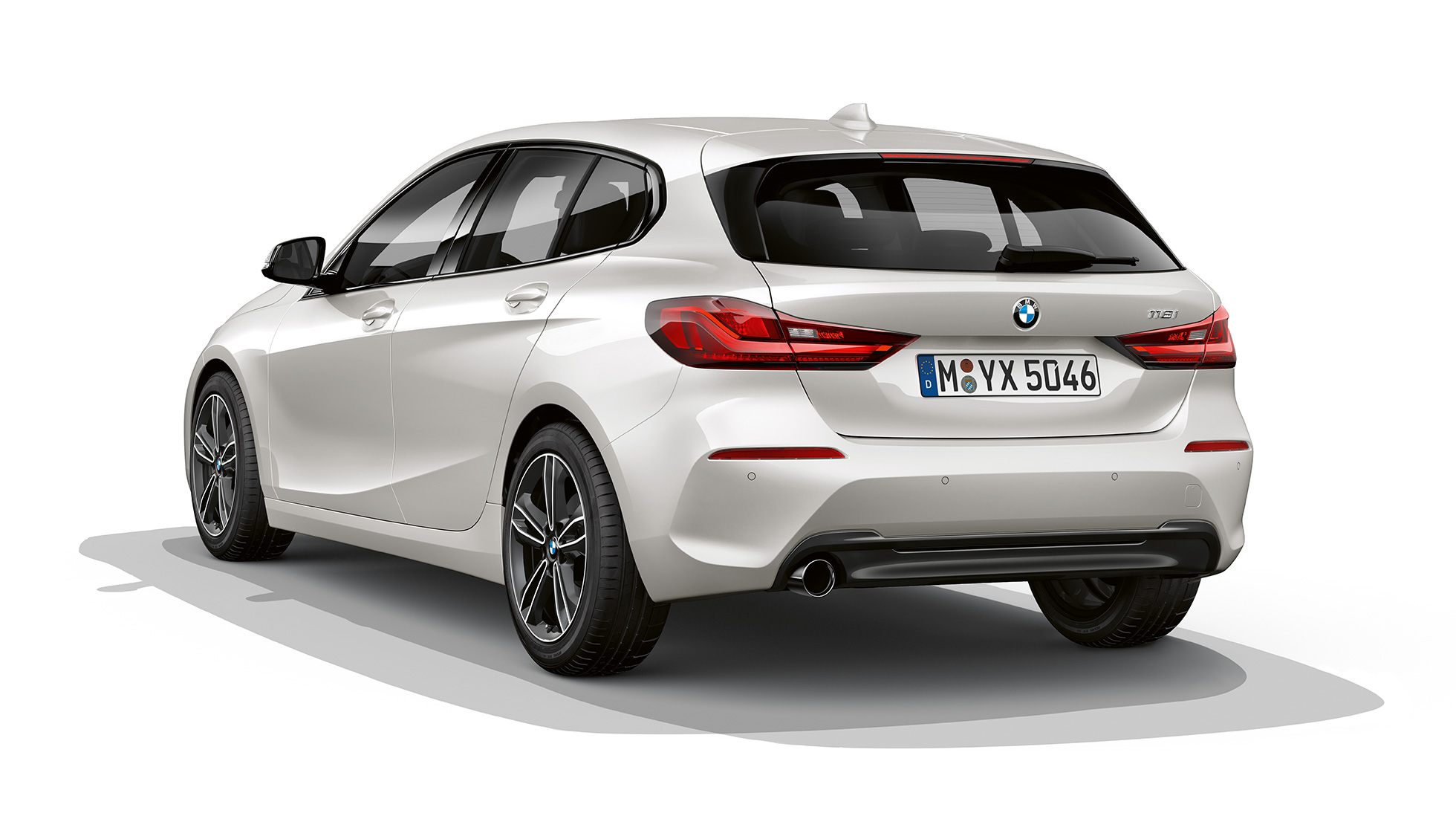 BMW 1 Series Model Sport Line, three-quarter rear. BMW 1 Series Model Sport Line in Mineral White metallic, studio shot three-quarter rear.