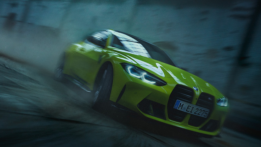 BMW M4 G82 2020 Sao Paulo Yellow three-quarter front view in motion