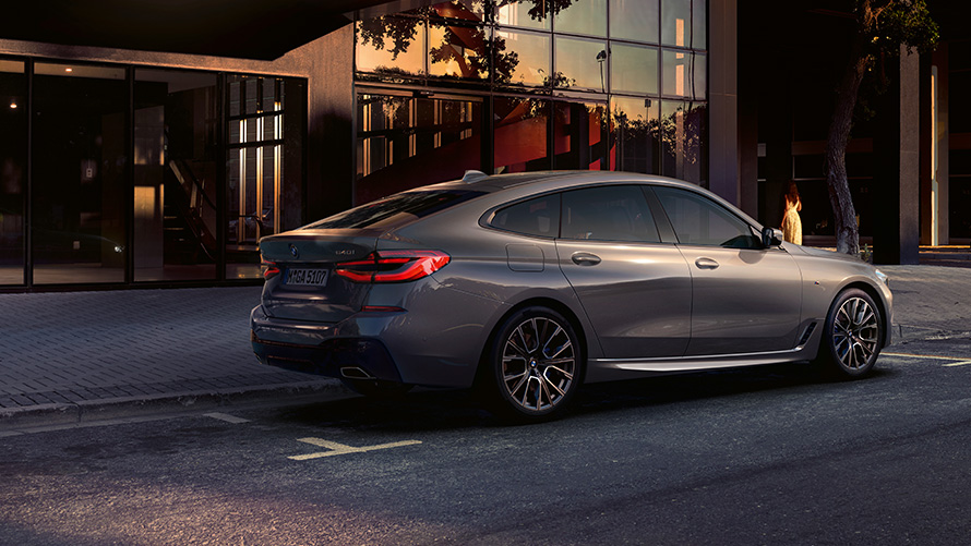 BMW 6 Series Gran Turismo 640i xDrive G32 2020 Bernina Grey side rear view parked in front of building  