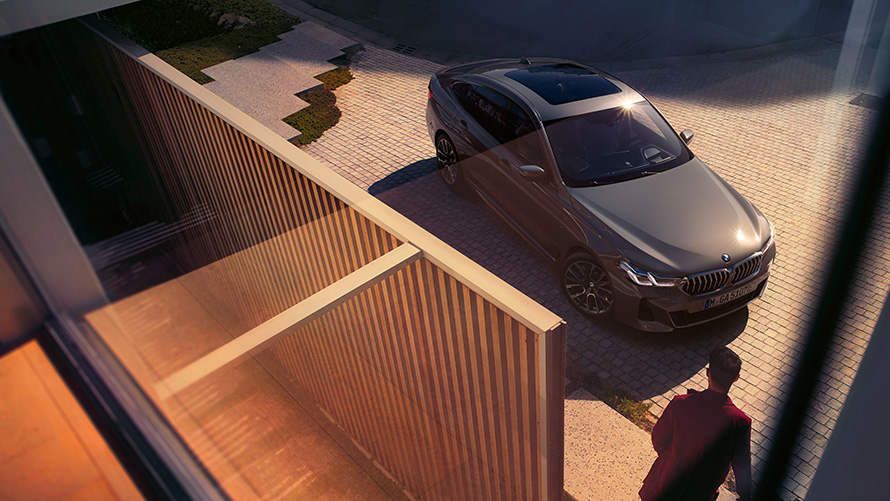 BMW 6 Series Gran Turismo 640i xDrive G32 2020 Bernina Grey three-quarter front bird’s eye view parked in front of building  