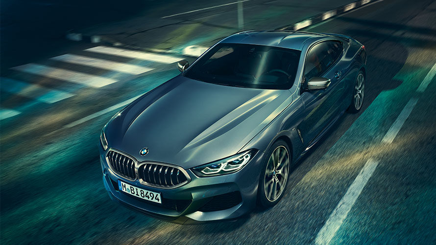 BMW 8 Series Coupé, three-quarter front view, standing with view on engine bonnet.
