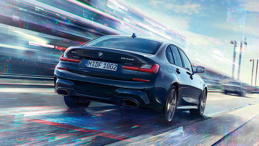 BMW M340i xDrive Sedan G20 2020 Sapphire Black metallic three-quarter rear view in motion