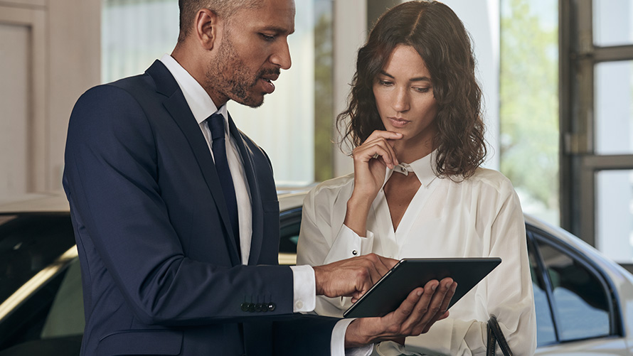 BMW customer support BMW Service employee talking to female customer