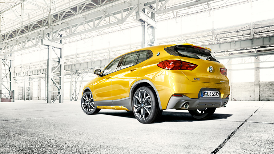 BMW X2 2018 F39 Galvanic Gold metallic three quarter rear view