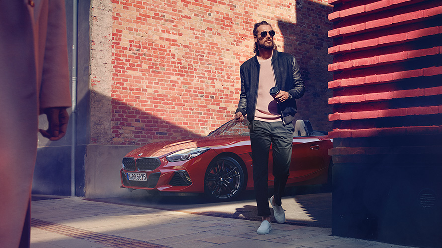 Man in a side street in front of BMW Z4 Roadster (G29)
