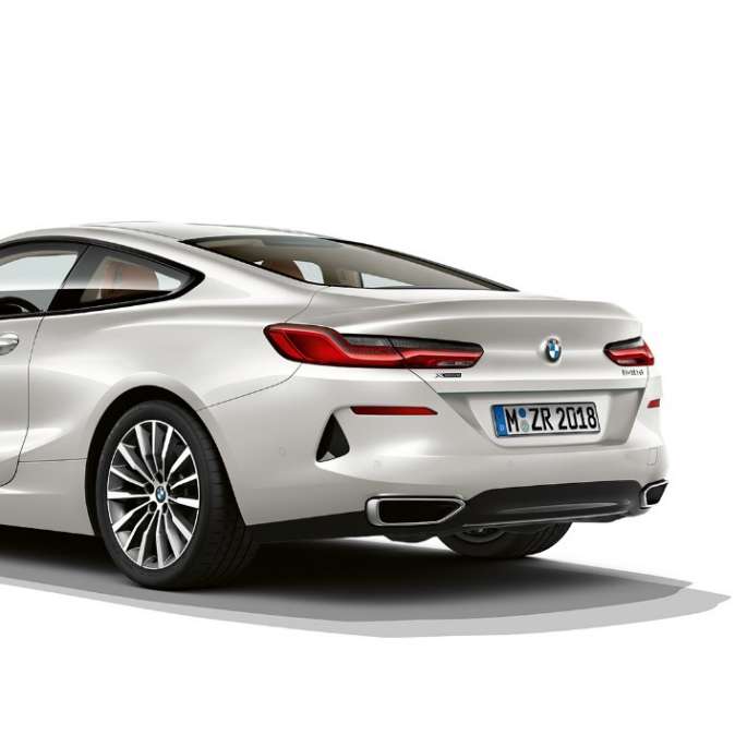 BMW 8 Series Coupé, Mineral White metallic, three-quarter back view.
