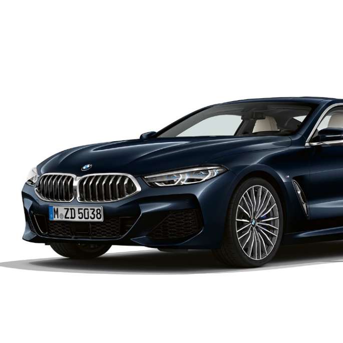 BMW 8 Series Coupé, Carbon Black metallic, three-quarter front view.